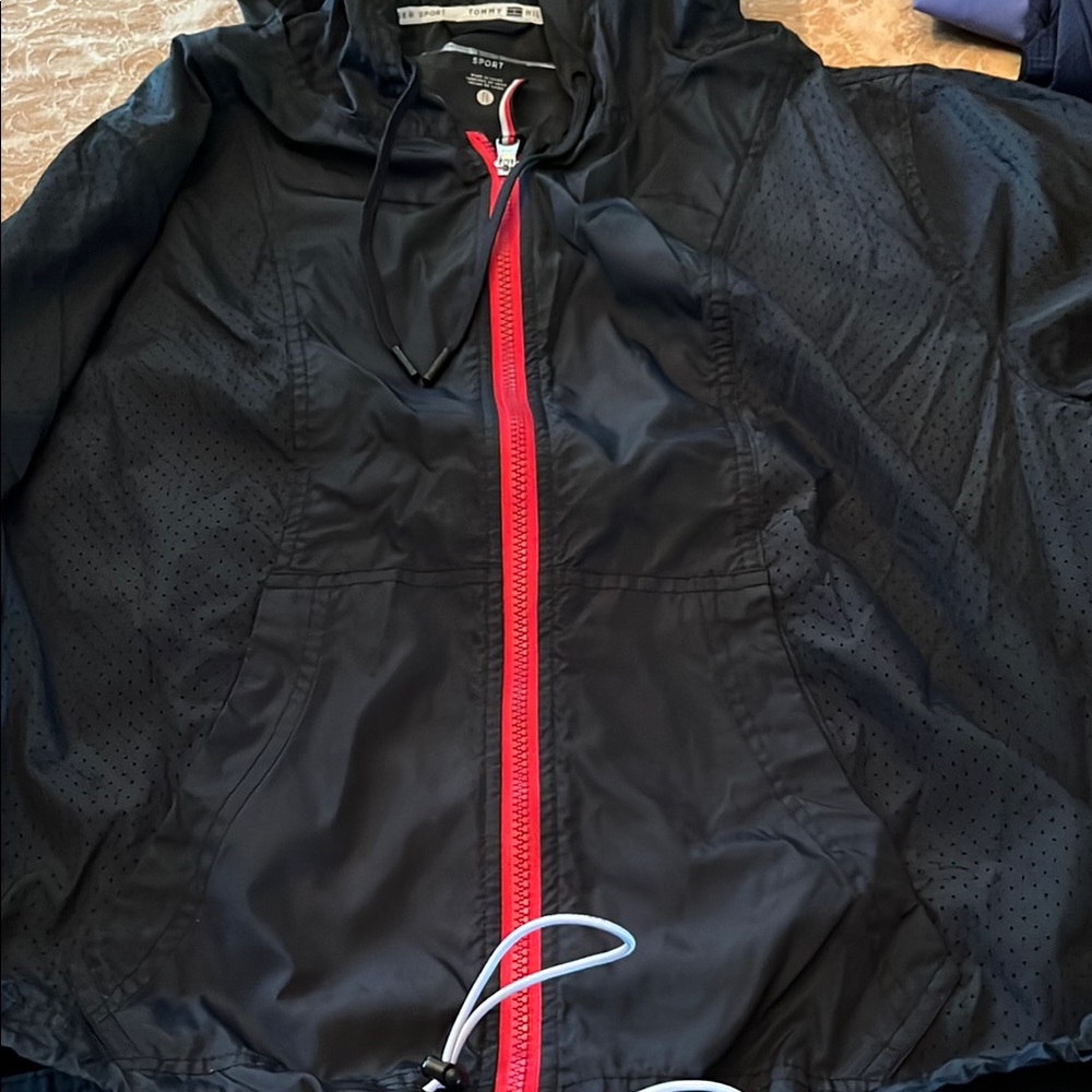 Tommy Hilfiger Navy wind breaker with Red Accents. Like a rain jacket!